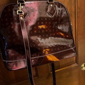 Arcadia patent leather bag in rich burgundy.